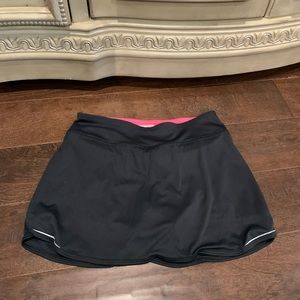 New balance skort, pink shorts underneath, zip pocket on back, size XS